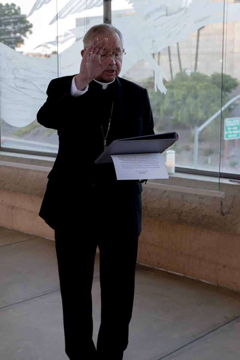 Archbishop José H. Gomez imparts a blessing before the lighting of candles in support of medical workers and their families. (Sarah Yaklic)