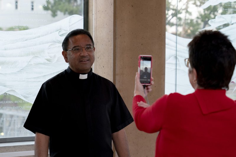Cathedral of Our Lady of the Angels pastor Fr. David Gallardo tapes a video message for the "Unite With Light" prayer campaign during the April 1 lighting of candles in support of medical workers and their families.
