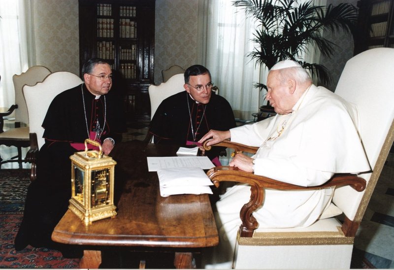 Auxiliary Bishop José H. Gomez (left) and Archbishop Charles J. Chaput, both of Denver, meet with St. Pope John Paul II in Rome in the early 2000s. (Courtesy Archbishop Gomez)