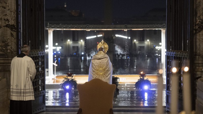 Pope Francis leads Benediction during a prayer service in an empty St. Peter's Square at the Vatican March 27, 2020. Although the pope usually draws large in-person crowds, during the COVID-19 pandemic his assemblies have reached the faithful through television, radio and the internet. (CNS photo/Vatican Media)