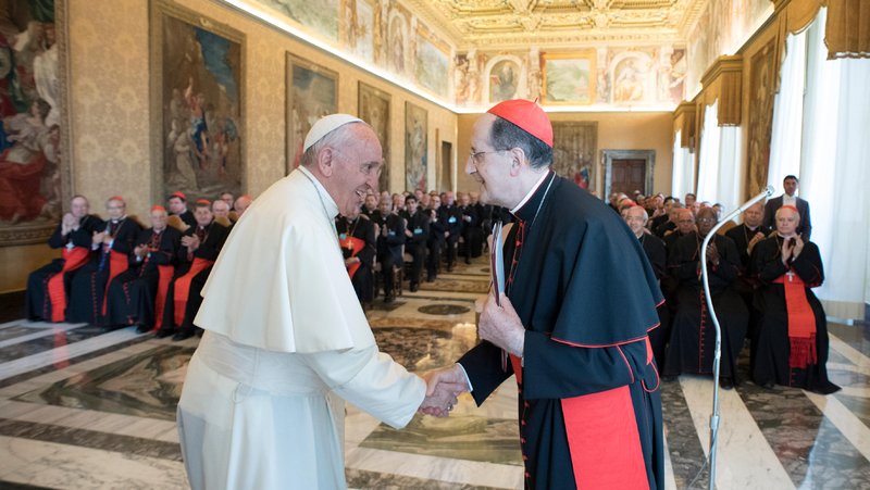 Pope Francis greets Cardinal Beniamino Stella, prefect of the Congregation for Clergy, during an audience with participants in the plenary assembly of the Congregation for Clergy at the Vatican June 1, 2017. Pope Francis has expanded the ranks of the top members of the College of Cardinals, naming as "cardinal bishops" Cardinal Stella and Cardinal Luis Antonio Tagle, prefect of the Congregation for the Evangelization of Peoples. (CNS photo/L'Osservatore Romano)