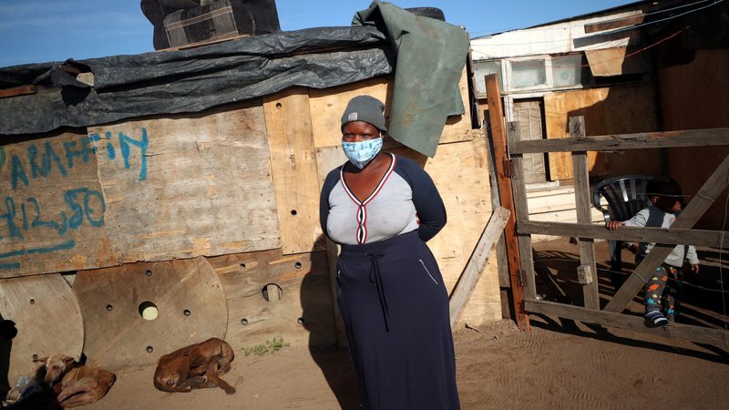 A community volunteer waits to distribute food to the needy in a poor section of Cape Town, South Africa, April 17, 2020, during the COVID-19 pandemic. (CNS photo/Mike Hutchings, Reuters)