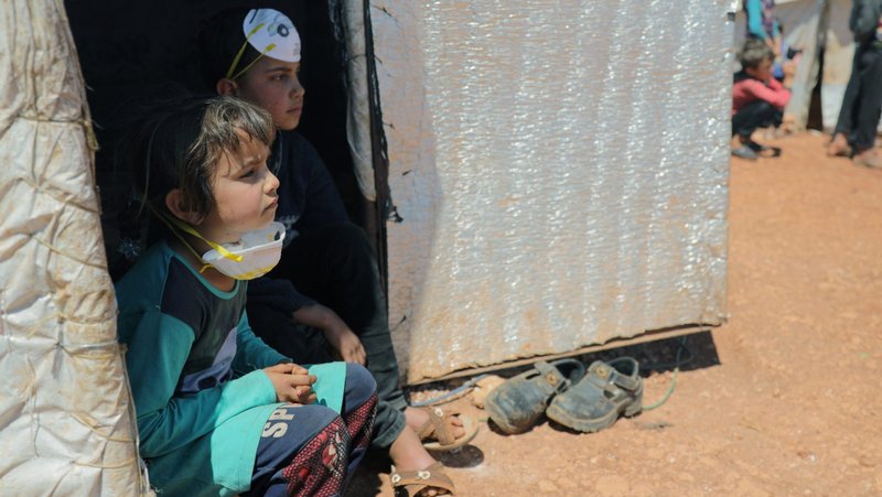 Displaced Syrian children are seen at a camp in Idlib April 14, 2020, during the COVID-19 pandemic. Internally displaced people, those forced to flee their homes, but who do not cross into another country, still often need protection and special assistance, including from the church, said a new Vatican document released May 5. (CNS photo/Khalil Ashawi, Reuters)
