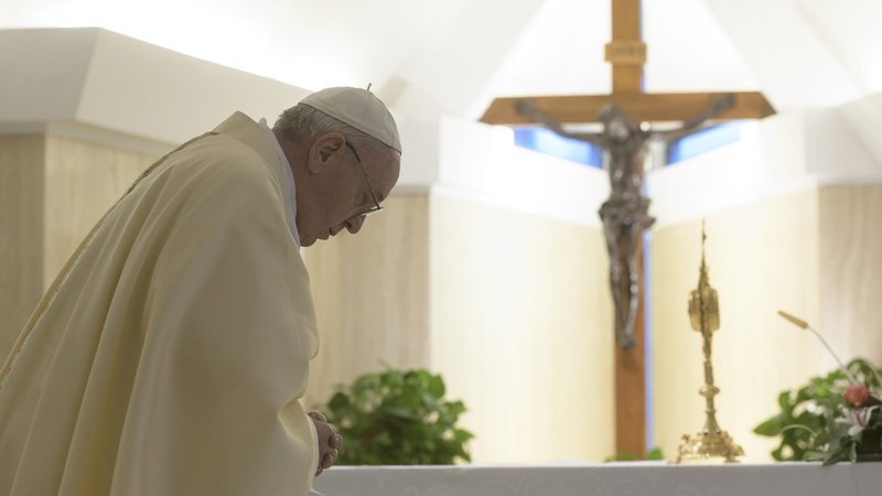 Pope Francis bows before the Blessed Sacrament during eucharistic adoration at the end of Mass May 8, 2020, in the chapel of his Vatican residence, the Domus Sanctae Marthae. (CNS photo/Vatican Media)