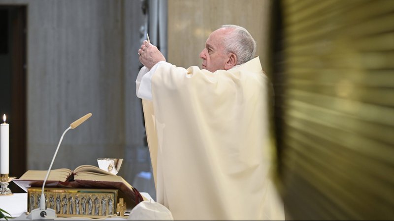 Pope Francis elevates the Eucharist as he celebrates Mass in the chapel of his residence, the Domus Sanctae Marthae, at the Vatican May 11, 2020. The pope prayed for the unemployed as countries continue to reel from the economic fallout of the coronavirus pandemic. (CNS photo/Vatican Media)