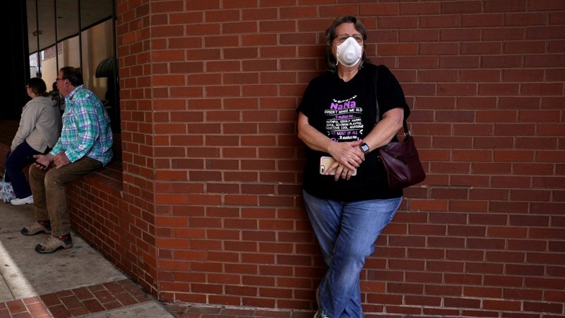 Regina Weaver of Fort Smith, Ark., waits in line to file for unemployment April 6, 2020, during the coronavirus pandemic. As of May 8, the U.S. Bureau of Labor Statistics reported the unemployment rate at 14.7%. (CNS photo/Nick Oxford, Reuters)