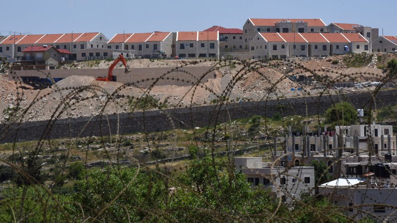 New housing units being built in the Israeli settlement Efrat are seen on the hillside overlooking a Palestinian village near Bethlehem, West Bank, May 10, 2020. The settlement would be included in the proposed annexation plan by Israeli Prime Minister Benjamin Netanyahu. (CNS photo/Debbie Hill)