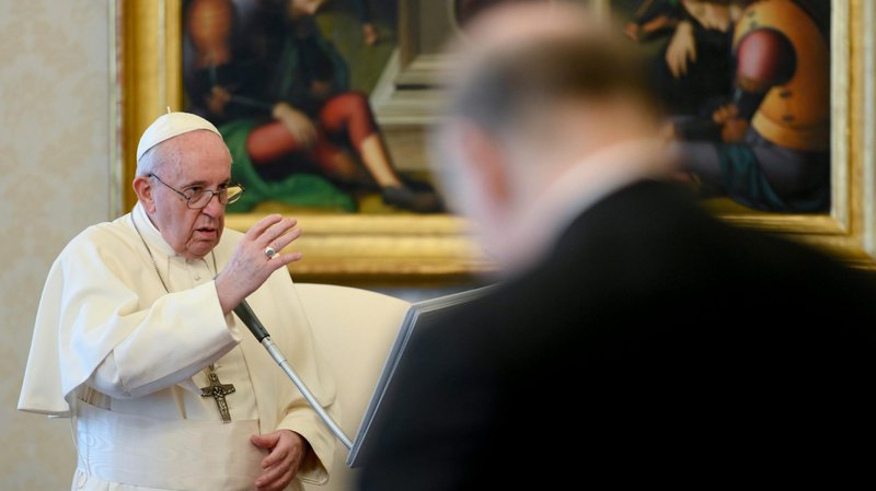 Pope Francis delivers his blessing as he leads his general audience in the library of the Apostolic Palace at the Vatican May 13, 2020. The pope greeted Portuguese speakers during the live-streamed audience as he commemorated the 103rd anniversary of the first Marian apparition in Fatima, Portugal. (CNS photo/Vatican Media)