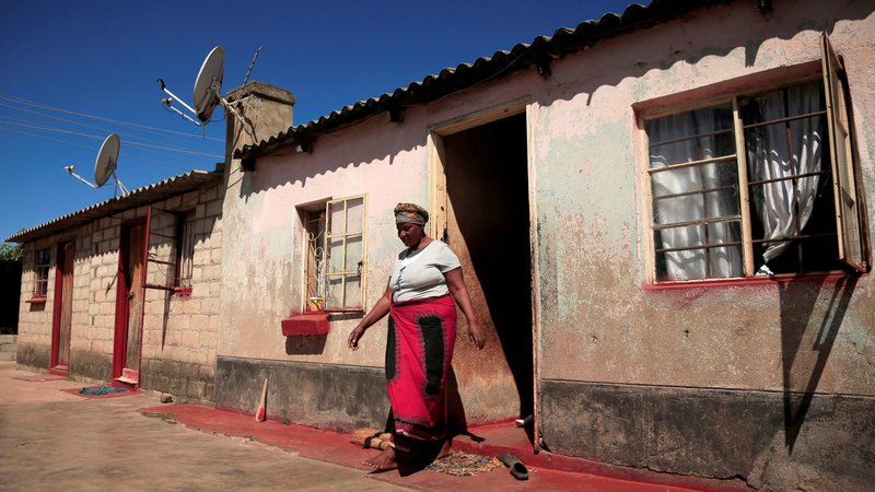 A woman walks out of her family home in Harare, Zimbabwe, May 9, 2020, during the COVID-19 pandemic. Church officials and experts say domestic violence in Africa is rising during government-enforced measures to fight COVID-19. (CNS photo/Philimon Bulawayo, Reuters)