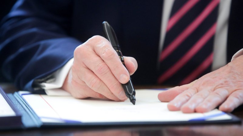 President Donald Trump signs the Paycheck Protection Program and Health Care Enhancement Act at the White House in Washington April 24, 2020. (CNS photo/Jonathan Ernst, Reuters)