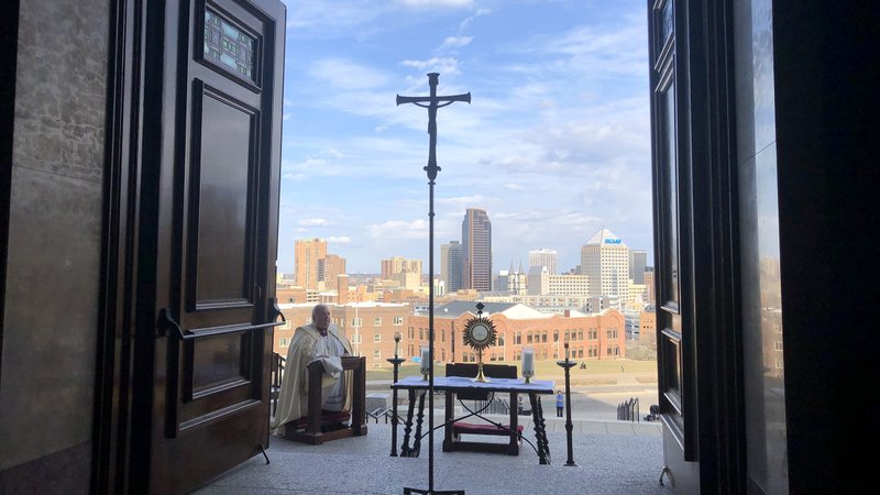 Archbishop Bernard A. Hebda of St. Paul and Minneapolis prays in front of the Blessed Sacrament at the Cathedral of St. Paul in St. Paul March 27, 2020. Minnesota bishops announced May 20 that they are moving forward with plans to reopen Mass, defying current state limitations requiring 10 or fewer people at faith-based gatherings. (CNS photo/Dave Hrbacek, The Catholic Spirit)