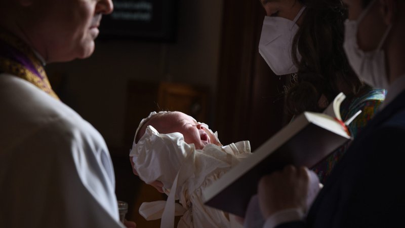 Beatrice Anne Borman is seen during her baptism at St. James Church in Falls Church, Va., April 18, 2020. Because of the coronavirus pandemic, Morgan Pino and Billy Borman were advised by their pediatrician to bring their newborn daughter from New York to Sterling, Va., and stay with Billy's parents. With most sacraments in the New York Archdiocese canceled, the couple "felt blessed" to have their baby baptized in the Arlington Diocese. (CNS photo/Zoey Maraist, Arlington Catholic Herald)
