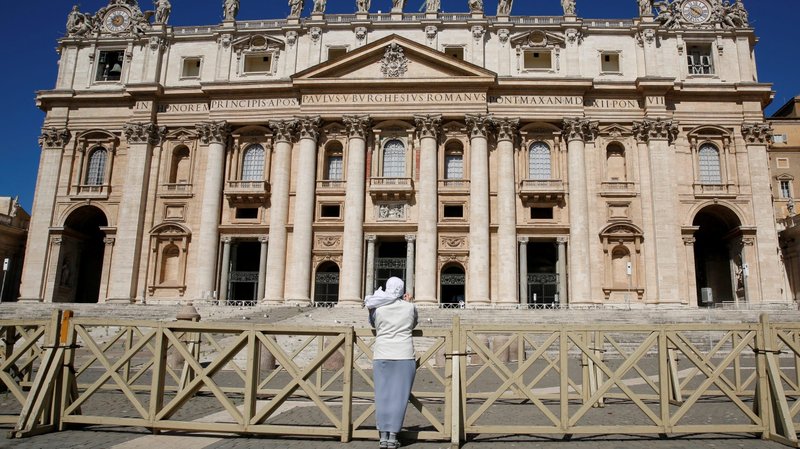 A nun prays in a deserted St. Peter's Square as Pope Francis holds the weekly general audience virtually in the library of the Apostolic Palace at the Vatican May 27, 2020. (CNS photo/Remo Casilli, Reuters)