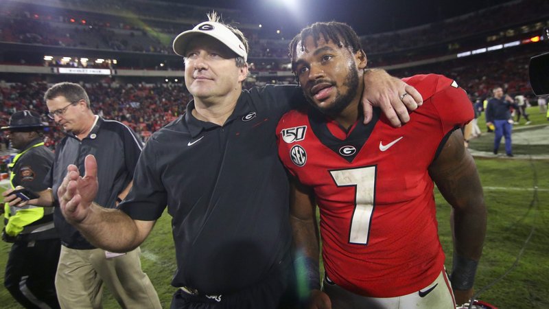 Georgia Bulldogs head coach Kirby Smart and running back D'Andre Swift walk off the field after defeating the Texas A&M Aggies at Sanford Stadium Nov. 23, 2019. The 2017 graduate of St. Joseph's Preparatory School in Philadelphia was drafted by the Detroit Lions in the second round of the 2020 NFL Draft April 24. (CNS photo/ Brett Davis-USA TODAY Sports via Reuters)