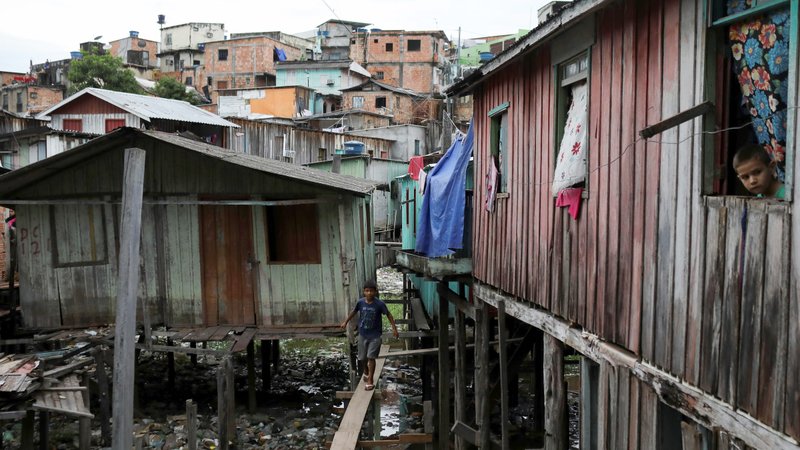 Children are seen in a poor section of Manaus, Brazil, May 19, 2020, during the COVID-19 pandemic. Catholic missionaries in Latin America say they have noticed disturbing signs of an increase in child abuse during the COVID-19 pandemic. (CNS photo/Bruno Kelly, Reuters)
