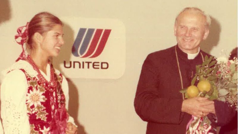 Cardinal Karol Wojtyla was welcomed August 29, 1976 by parishioners of Our Lady of Bright Mount Parish at LAX Airport's "Red Carpet Room" with an arrangement of oranges. (Tidings Archives)