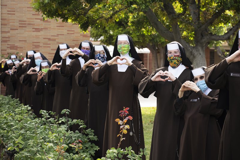 The sisters at Sacred Heart House in Alhambra prepared care packages and honored the Order of Malta with a rendition of "Rejoice in the Lord." (Victor Alemán)