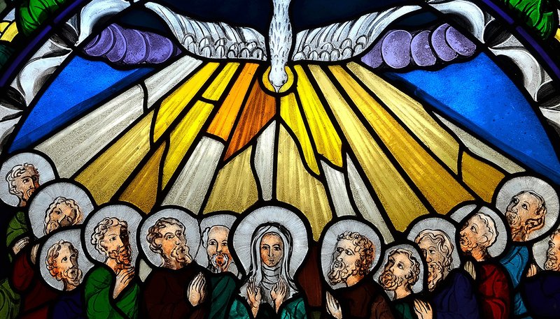 A stained glass window depicting Pentecost. (Shutterstock)