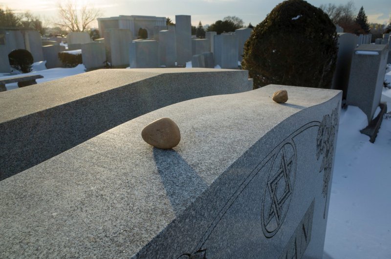 Visitation stones left as an act of remembrance on a Jewish gravestone. (Shutterstock)