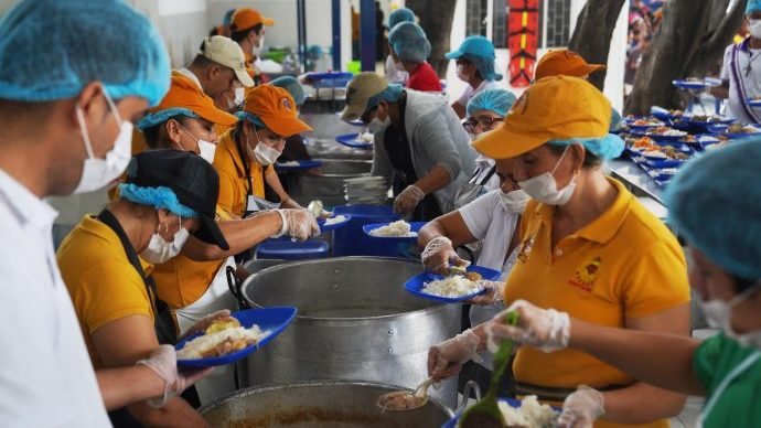 Volunteers from a Catholic charity prepare meals at the Divine Providence food pantry in Cucuta, Colombia, Jan. 31, 2020. The food pantry serves up to 6,000 people per day, mostly Venezuelan migrants. (Manuel Rueda/CNS via Crux)
