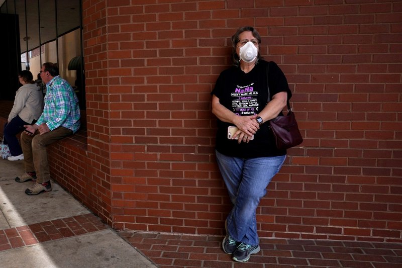 Regina Weaver of Fort Smith, Arkansas, waits in line to file for unemployment April 6 during the coronavirus (COVID-19) pandemic. (Catholic News Service/Nick Oxford, Reuters)