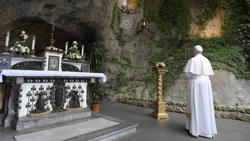 Pope Francis prays at the Lourdes grotto during a Marian prayer service in the Vatican Gardens May 30, 2020. (CNS photo/Vatican Media)