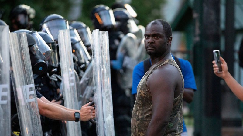 A police protester in Atlanta demonstrates May 31, 2020. Demonstrations continue after a white police officer in Minneapolis was caught on a bystander's video May 25 pressing his knee into the neck of George Floyd, an African American, who later died at a hospital. (CNS photo/Dustin Chambers, Reuters)