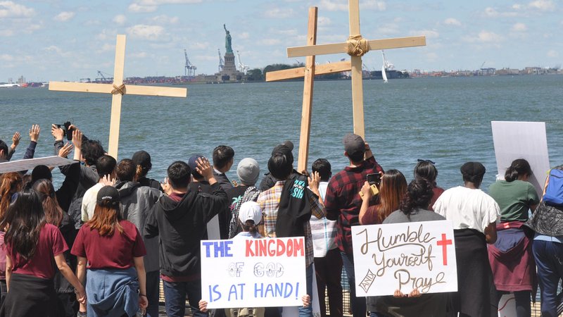 Korean American Christian evangelists demonstrate near the Statue of Liberty June 7, 2020, during the coronavirus pandemic. (CNS photo/Ed Wilkinson, The Tablet)