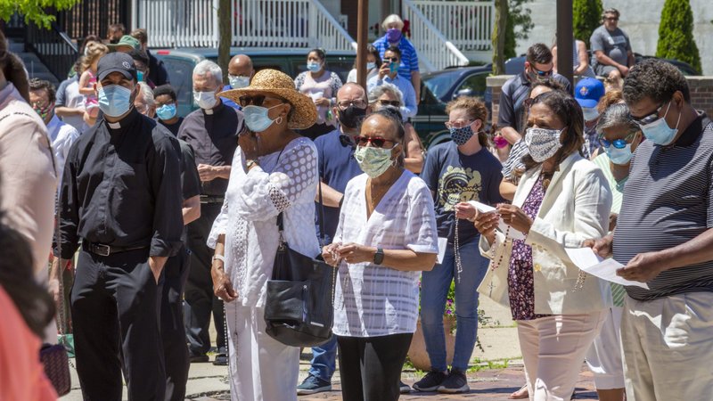 People in Detroit pray the rosary outside outside the Basilica of Ste. Anne de Detroit June 7, 2020. June 7, 2020. (CNS photo/Jim West)
