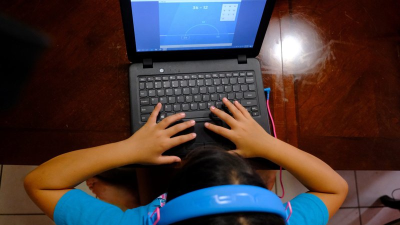 Hazeline Panditaratne completes her math assessments on her computer in her Broward County, Fla., home May 29, 2020. Students throughout the world were required to finish up their school year in their homes, making it more difficult in marginalized communities and rural areas that have limited broadband internet access. (CNS photo/Maria Alejandra Cardona, Reuters)