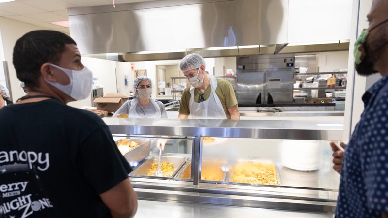 Resident guests at Camillus House in downtown Miami maintain social distance in the cafeteria April 30, 2020, during the coronavirus pandemic. (CNS photo/Tom Tracy)
