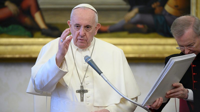 Pope Francis delivers his blessing as he leads his general audience in the library of the Apostolic Palace at the Vatican June 17, 2020. During the audience, the pope said that true believers do not condemn people for their sins or shortcomings but intercede on their behalf with God through prayer. (CNS photo/Vatican Media)