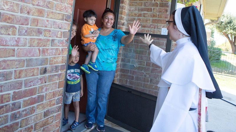 Sister Gabriela Luna Diaz, a member of the Eucharistic Missionaries of St. Teresa, visits a family in northwestern Wisconsin in this undated photo. She is part of Catholic Extension's U.S.-Latin American Sisters Exchange Program that helps Hispanic populations face the hardships of the coronavirus crisis. (CNS photo/Rich Kalonick, Catholic Extension)