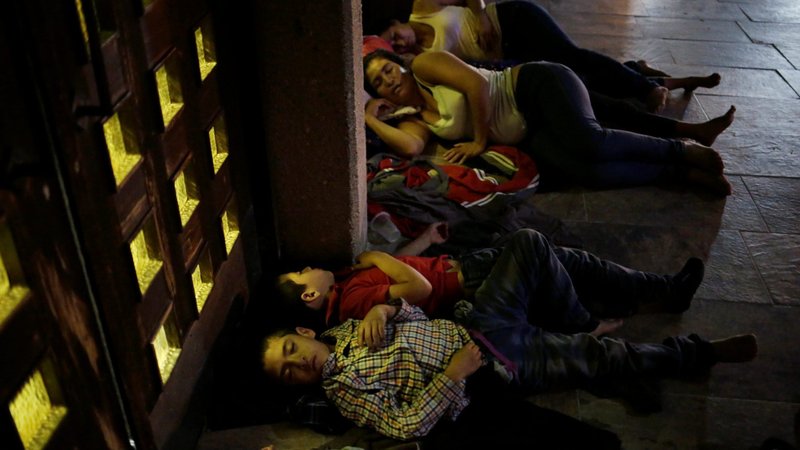 Central American migrants sleep outside Our Lady of Guadalupe Cathedral in Ciudad Juarez, Mexico, July 14, 2019, awaiting their U.S. court hearings for asylum. In a 7-2 decision June 25, 2020, the Supreme Court ruled that immigrants whose requests for asylum were rejected may not contest the denials in federal court. (CNS photo/Jose Luis Gonzalez, Reuters)