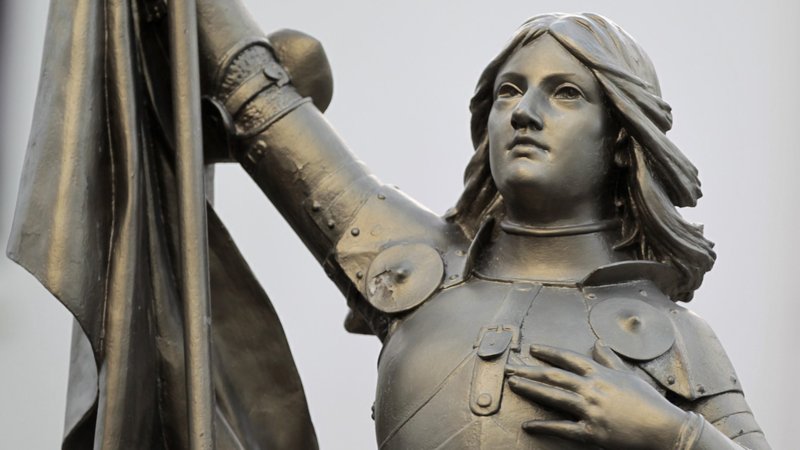A statue of St. Joan of Arc is seen in the courtyard of the headquarters of the National Front political party in Nanterre, France, in this 2012 photo. This year, the Catholic Church celebrates the 100th anniversary of the canonization of St. Joan of Arc, whose image transcends political divisions. (CNS photo/Charles Platiau, Reuters)