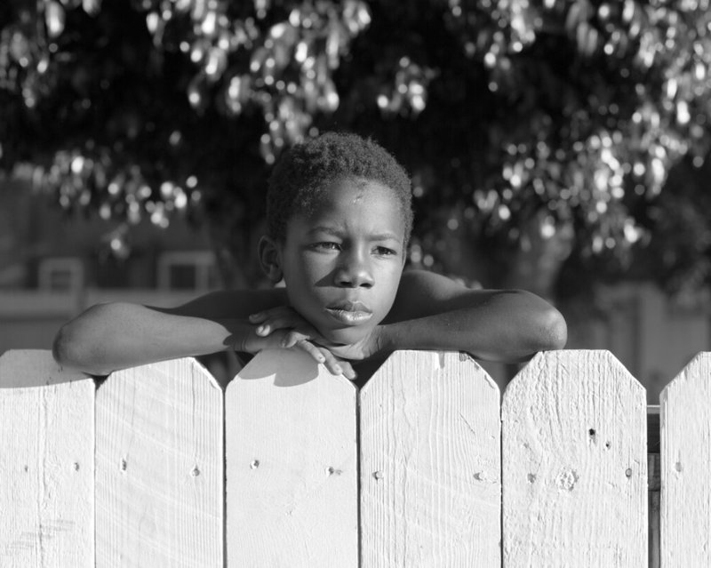 “Boy, Fence,” 2019, from Kovi Konowiecki’s “Cherry Ave” series. (Kovi Konowiecki/ROSEGALLERY)