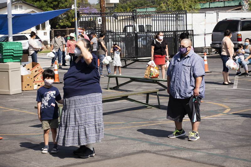 Free play equipment was distributed to local youth May 28 at Our Lady of Guadalupe School in East LA thanks to a partnership between the Department of Catholic Schools with the Play Equity Fund and LA84 Foundation. The initiative was meant to encourage outdoor activities for youth confined at home due to COVID-19 restrictions. (Victor Alemán)