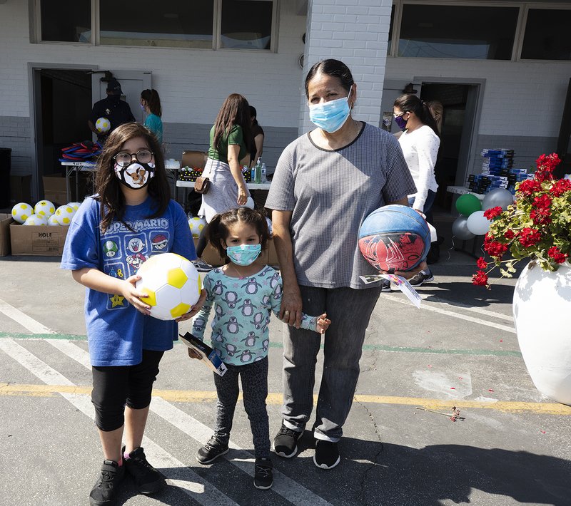 Free play equipment was distributed to local youth May 28 at Our Lady of Guadalupe School in East LA thanks to a partnership between the Department of Catholic Schools with the Play Equity Fund and LA84 Foundation. The initiative was meant to encourage outdoor activities for youth confined at home due to COVID-19 restrictions. (Victor Alemán)
