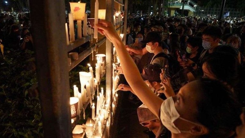People light candles as they attend a vigil in Victoria Park in Hong Kong on June 4, 2020. (Yan Zhao/AFP via Getty Images)