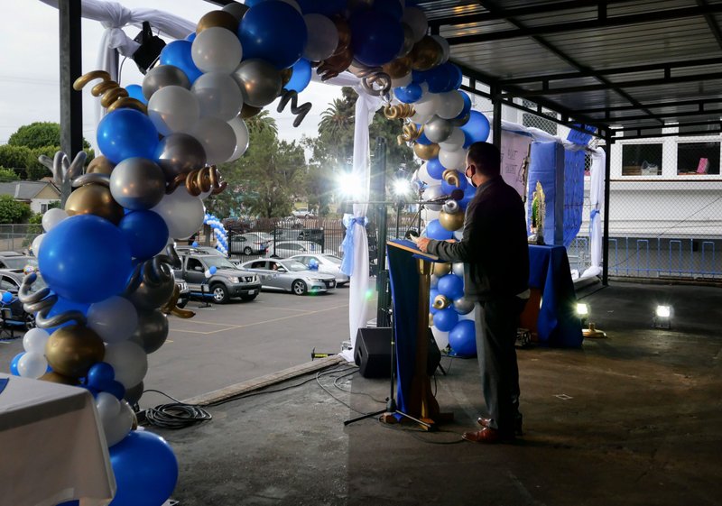 John Rojas, director de Our Lady of Talpa School en Boyle Heights, habla durante la ceremonia de graduacion 5 junio, 2020. (John Michael Filippone)