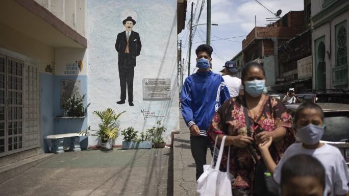 Pedestrians walk past a mural depicting Dr. Jose Gregorio Hernandez, in Caracas, Venezuela, Saturday, June 20, 2020. Pope Francis signed a decree for the beatification of Hernández, who is popularly known as the "doctor of the poor," local church authorities announced Friday. (Ariana Cubillos/AP via Crux)