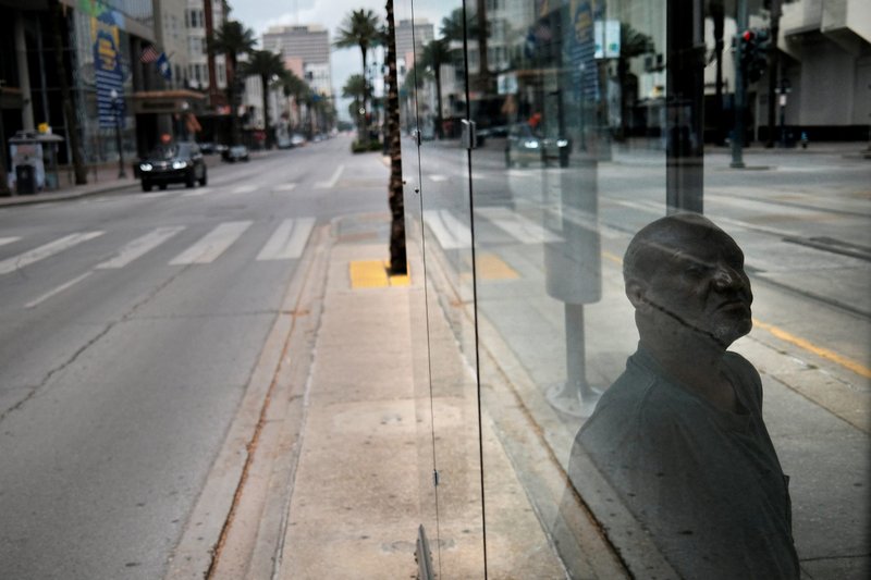 A person in New Orleans waits for the bus April 7, 2020, during the coronavirus pandemic. (CNS photo/Carlos Barria, Reuters)