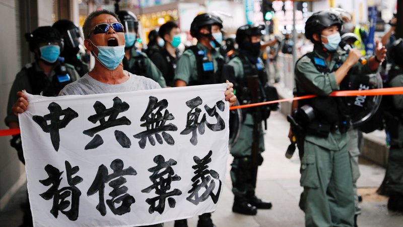 A man holding a banner reading "Chinese communist party is shameless, break the promises," shouts during a protest against the new national security law in Hong Kong July 1, 2020. (CNS photo/Tyrone Siu, Reuters)