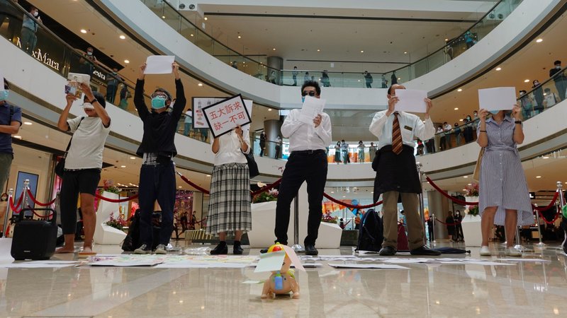 Demonstrators take part in a lunchtime protest against the national security law at a mall in Hong Kong July 6, 2020. (CNS photo/Joyce Zhou, Reuters)