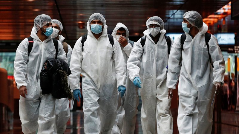 Seafarers who had spent months working aboard vessels during the COVID-19 pandemic arrive June 12, 2020, at Changi Airport in Singapore. (CNS photo/Edgar Su, Reuters)