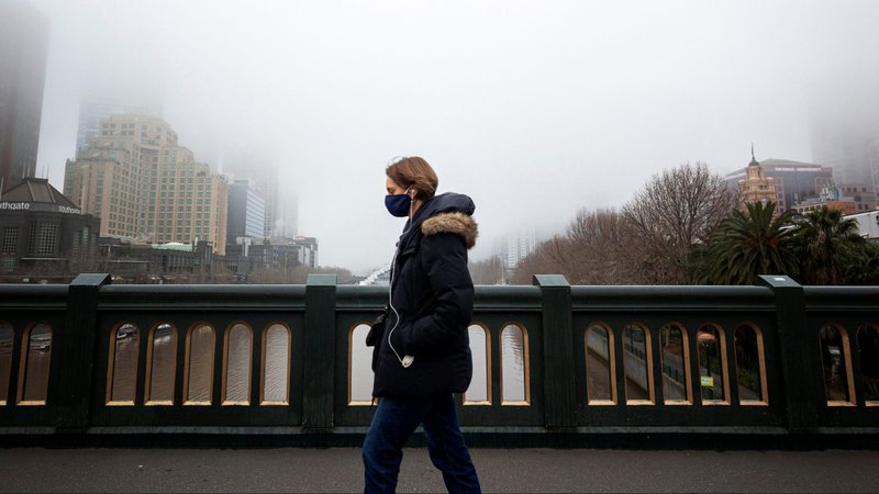 A person in a protective face mask walks along the Princes Bridge in Melbourne, Australia, July 17, 2020, during a lockdown in response to the coronavirus pandemic. (CNS photo/Daniel Pockett, Reuters)