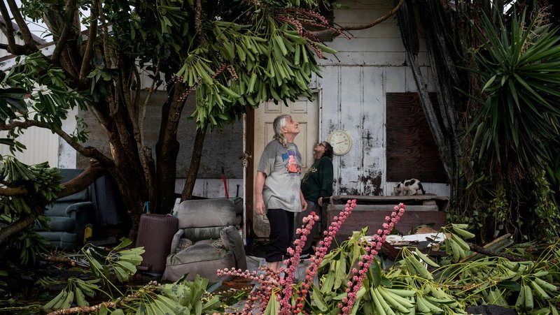 A couple in Port Mansfield, Texas, survey their destroyed home in the aftermath of Hurricane Hanna July 26, 2020. (CNS photo/Adrees Latif, Reuters)