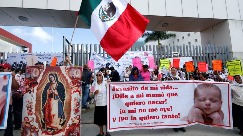 Pro-life supporters pray during a 2019 protest outside the local congress in Oaxaca, Mexico. In late July, Mexico's bishops called on Catholics to speak out ahead of a ruling from the country's Supreme Court, which could lead to a nationwide decriminalization of abortion. (CNS photo/Jorge Luis Plata, Reuters)