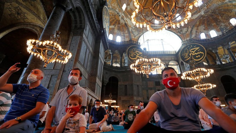 Worshippers attend afternoon prayer at Hagia Sophia Grand Mosque in Istanbul July 26, 2020. Hagia Sophia was built as an Orthodox Christian cathedral and stood as the seat of Eastern Christianity for a thousand years before Ottoman Turks conquered its host city and turned it into a mosque in 1453. In 1934, it was designated as a museum revered as a symbol of Christian and Muslim unity until being transformed into a mosque this July. (CNS photo/Murad Sezer, Reuters)