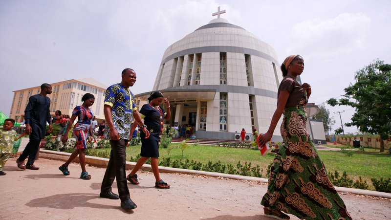 People leave St. Gabriel Catholic Church following Mass in late March in Abuja, Nigeria. (CNS photo/Afolabi Sotunde, Reuters)